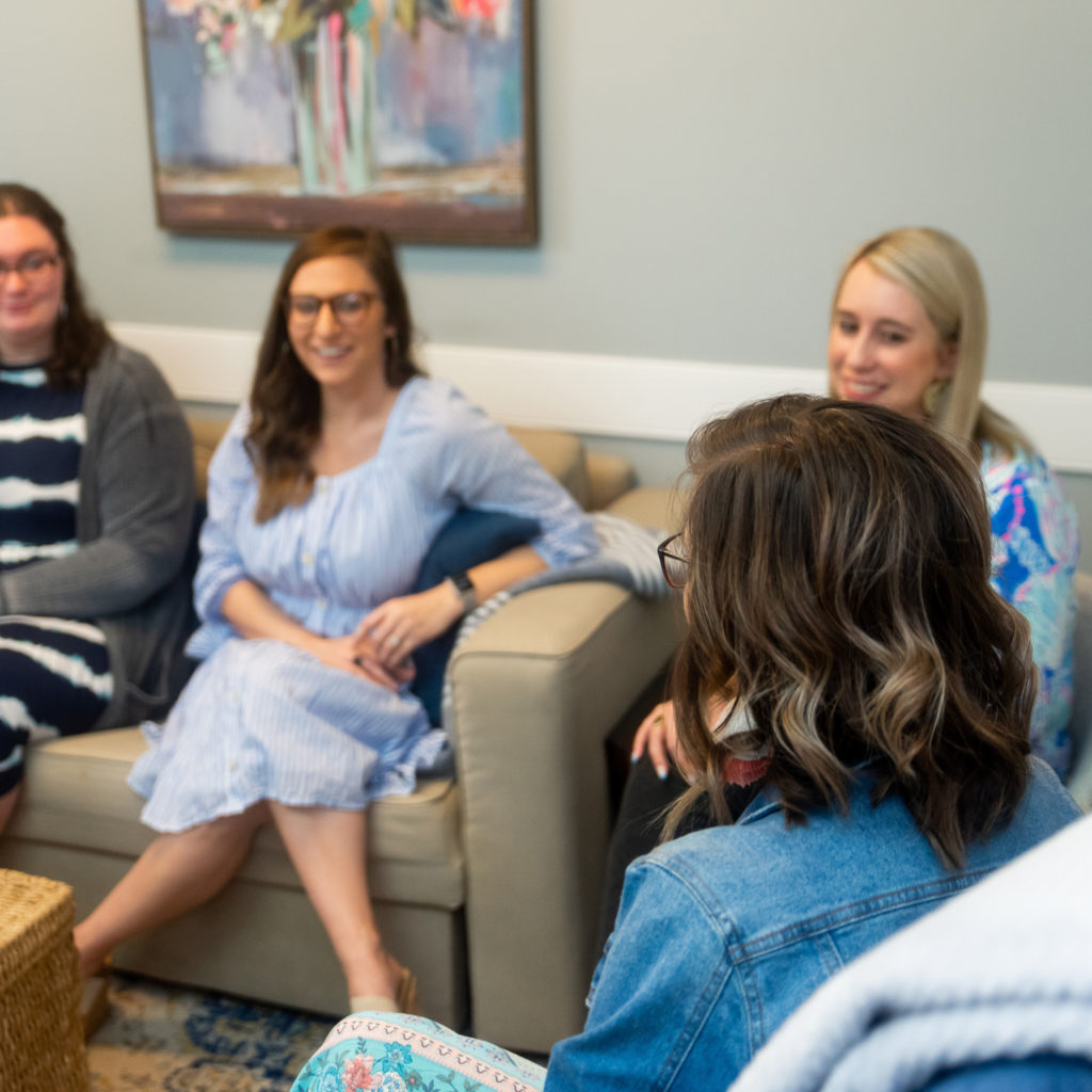 Therapist sitting on the couches talking.