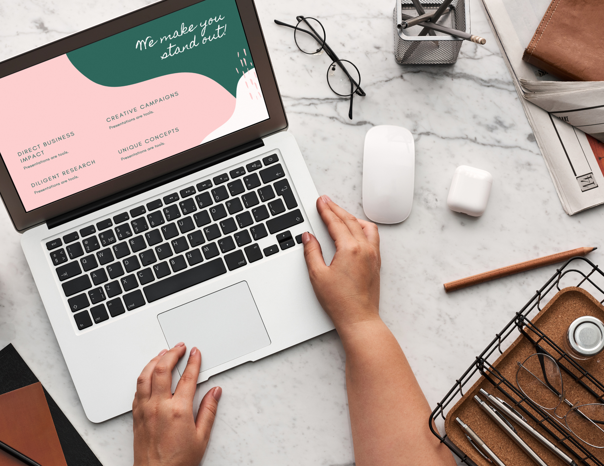 Hands typing on laptop